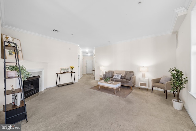 living area with light colored carpet, a fireplace with flush hearth, visible vents, baseboards, and crown molding