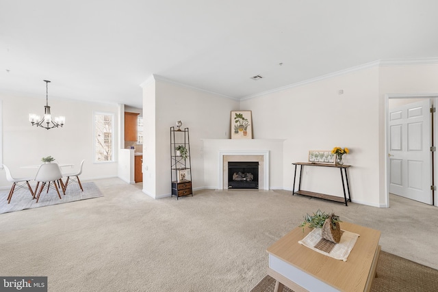 living area featuring crown molding, baseboards, a fireplace with flush hearth, and light colored carpet