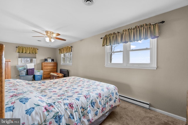 carpeted bedroom featuring ceiling fan, baseboards, visible vents, and baseboard heating