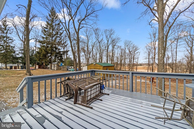 wooden deck featuring an outdoor structure