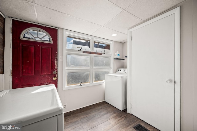 laundry area featuring washer / dryer, visible vents, laundry area, and wood finished floors