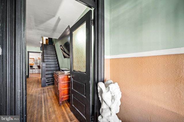 corridor with stairway and dark wood-style flooring