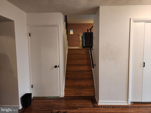 stairway featuring hardwood / wood-style flooring