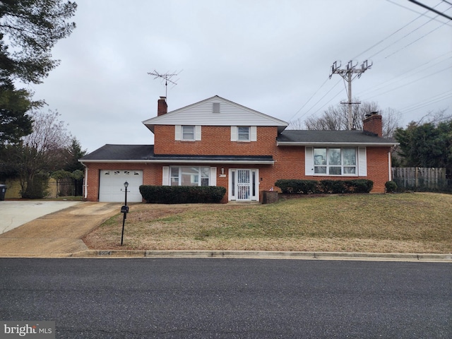 view of front of home featuring a garage and a front yard