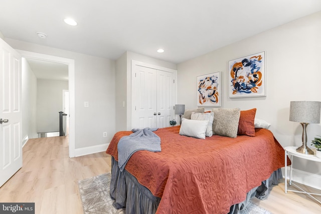 bedroom with a closet and light wood-type flooring