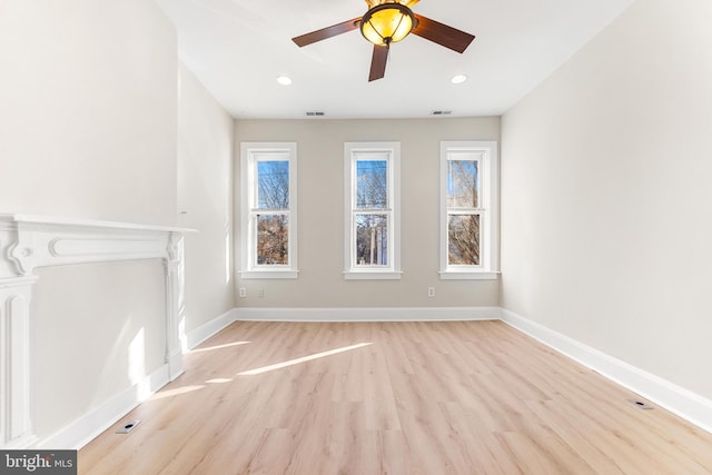 unfurnished room featuring ceiling fan and light hardwood / wood-style flooring