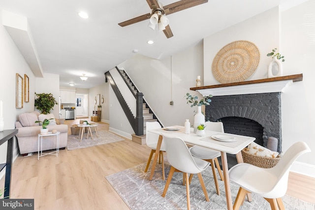 dining room featuring ceiling fan and light hardwood / wood-style flooring