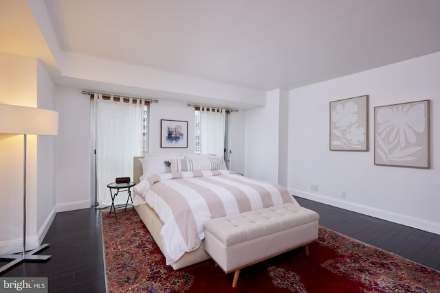 bedroom featuring dark wood-type flooring