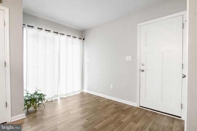 empty room with wood-type flooring