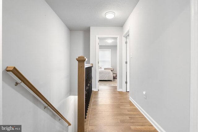 hall with light hardwood / wood-style flooring