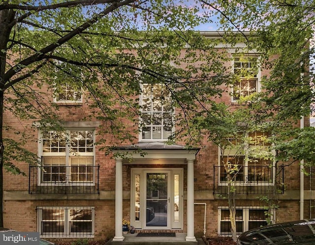 property entrance with brick siding