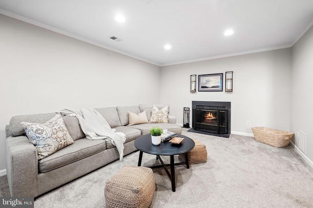 living room featuring ornamental molding, carpet flooring, visible vents, and baseboards