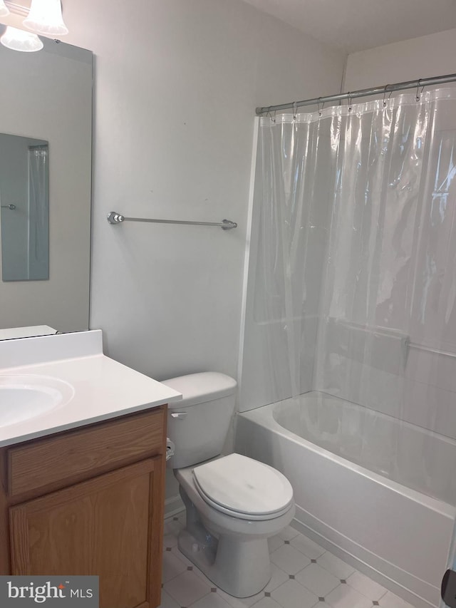 full bathroom with toilet, shower / tub combo with curtain, and vanity