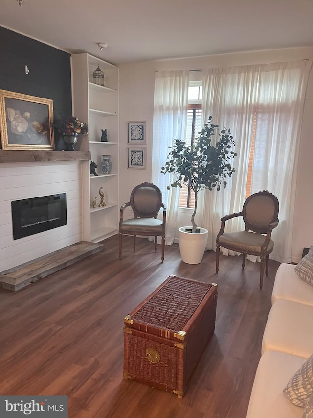 sitting room featuring dark hardwood / wood-style floors