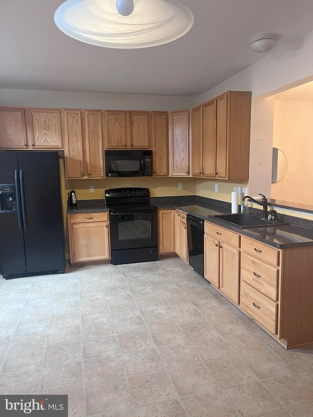 kitchen featuring sink and black appliances