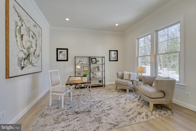 office featuring light wood-type flooring, crown molding, baseboards, and recessed lighting