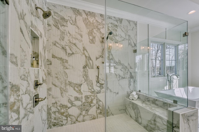 bathroom with a marble finish shower and crown molding