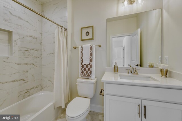 full bath with marble finish floor, shower / tub combo with curtain, vanity, and toilet