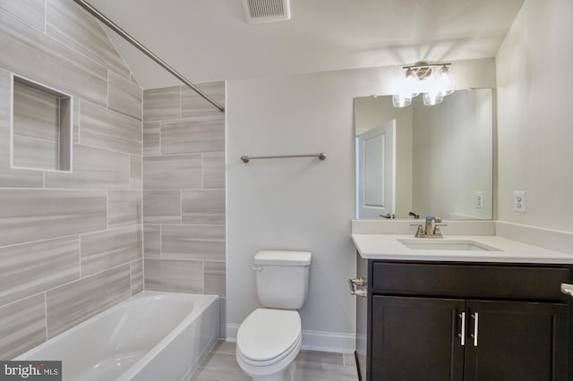 bathroom featuring bathtub / shower combination, visible vents, toilet, vanity, and baseboards