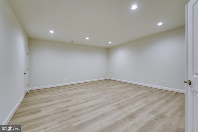 empty room with recessed lighting and light wood-style flooring