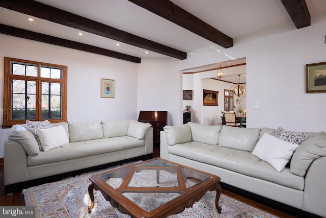 living room featuring beam ceiling, french doors, dark wood-style flooring, and recessed lighting