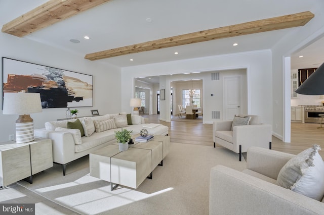 living room featuring recessed lighting, beam ceiling, light wood-style floors, and visible vents