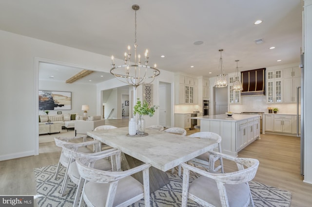 dining space with recessed lighting, light wood-type flooring, baseboards, visible vents, and a notable chandelier