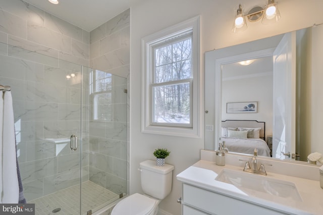 ensuite bathroom featuring vanity, ensuite bath, toilet, and a shower stall