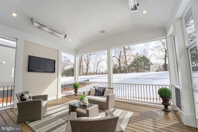 sunroom featuring an outdoor hangout area