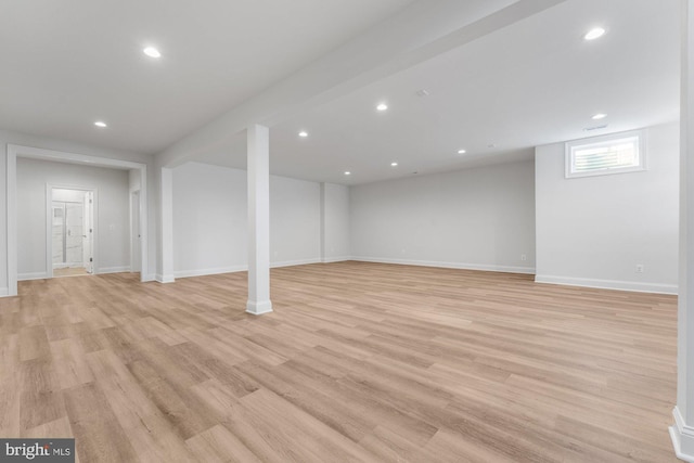 below grade area with baseboards, recessed lighting, and light wood-type flooring