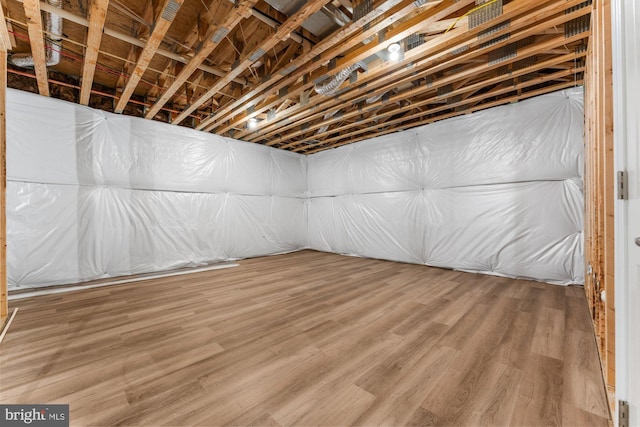 unfinished basement with wood finished floors