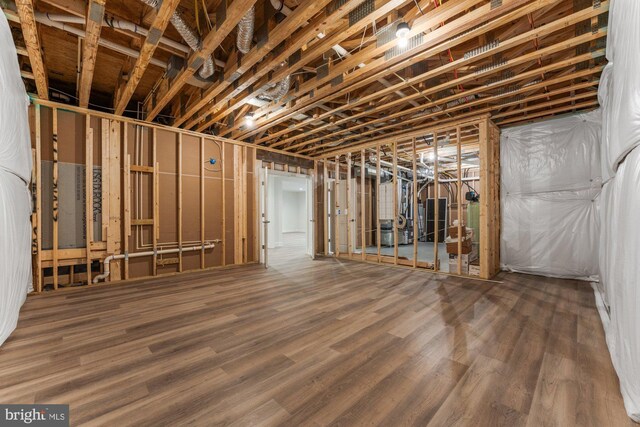 unfinished below grade area featuring wood finished floors