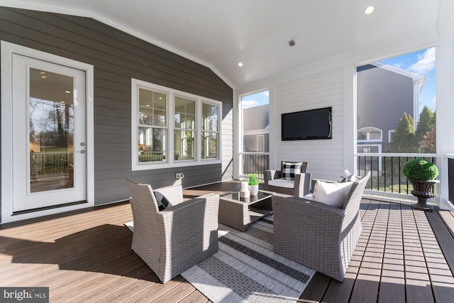 wooden terrace featuring an outdoor living space