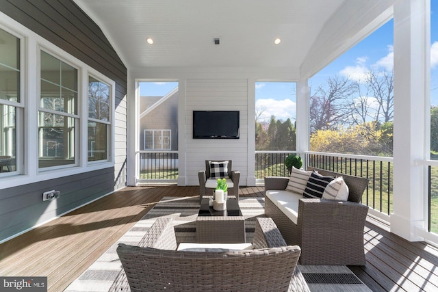 sunroom / solarium featuring an outdoor living space