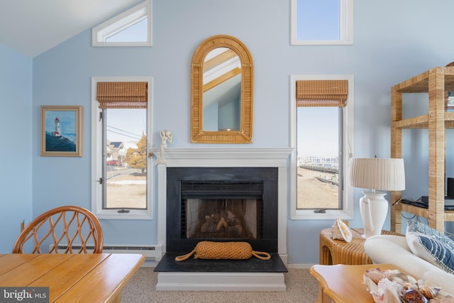 living area with carpet floors, high vaulted ceiling, plenty of natural light, and baseboard heating