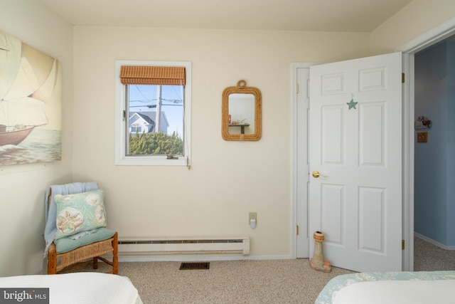 bedroom featuring carpet flooring and a baseboard radiator