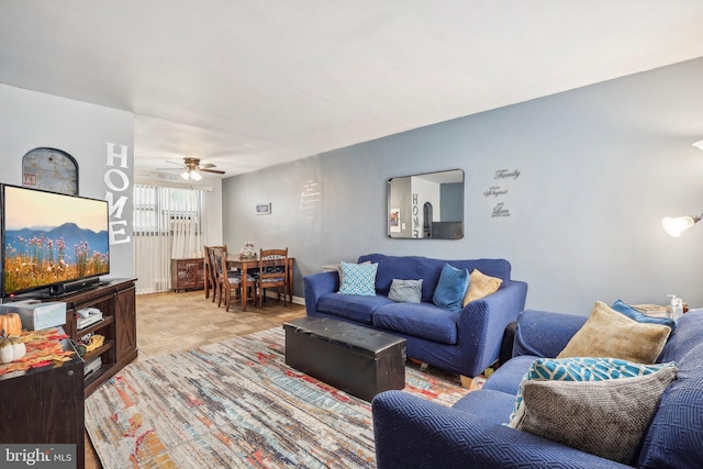 living room with ceiling fan and light parquet floors