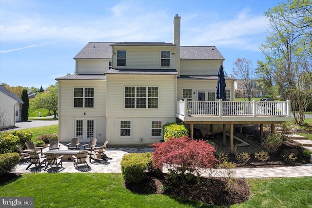 450 Marley Run, Huntingtown, MD 20639 - back of house with a deck, a chimney, french doors, a patio, and a yard