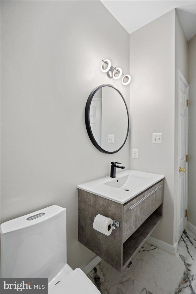 450 Marley Run, Huntingtown, MD 20639 - half bath featuring toilet, baseboards, marble finish floor, and vanity