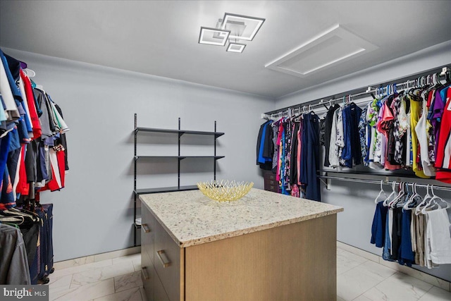 450 Marley Run, Huntingtown, MD 20639 - walk in closet featuring marble finish floor and attic access