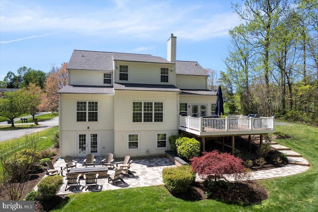 450 Marley Run, Huntingtown, MD 20639 - back of house featuring french doors, a chimney, a deck, a patio area, and an outdoor fire pit
