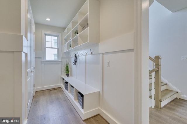 mudroom featuring light wood finished floors and recessed lighting