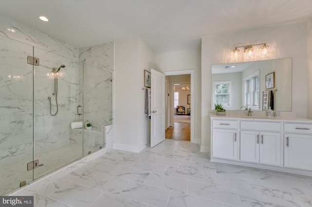 full bathroom featuring marble finish floor, baseboards, and a marble finish shower