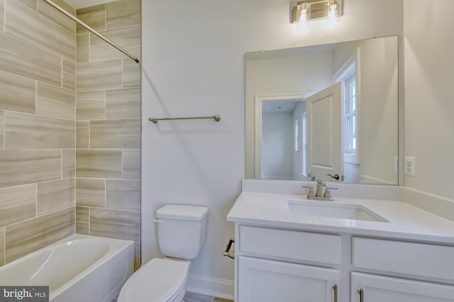 bathroom with toilet, bathtub / shower combination, and vanity