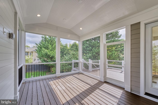 unfurnished sunroom featuring plenty of natural light, wooden ceiling, and vaulted ceiling