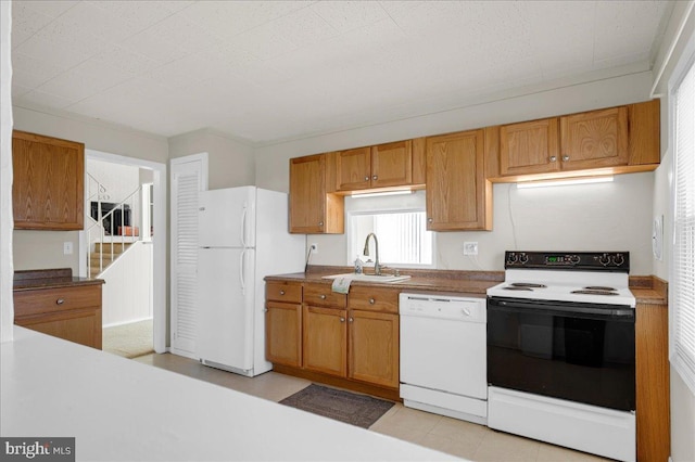 kitchen featuring sink and white appliances