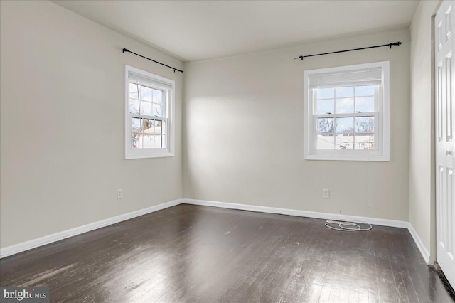 unfurnished room featuring dark wood-type flooring