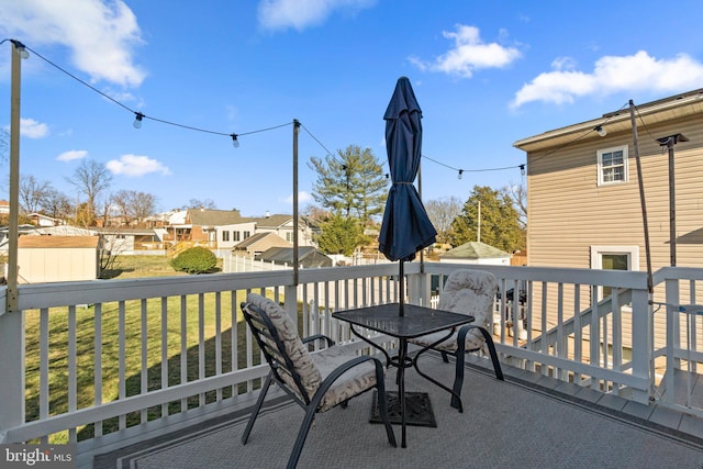 wooden deck with a yard