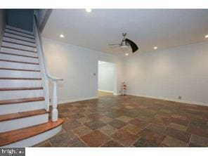 garage with baseboards, a ceiling fan, and recessed lighting