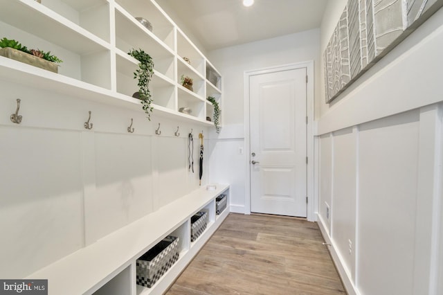 mudroom with light wood finished floors